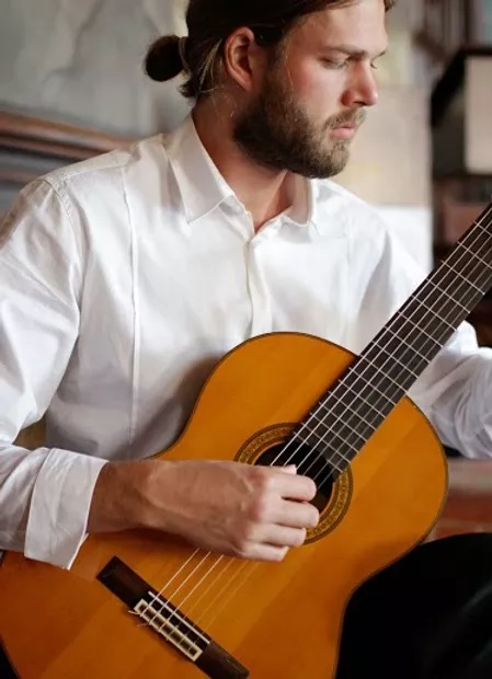 Image of Bill Dickman, a guitar teacher from Madison Wisconsin, playing classical guitar.